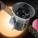 Illustration of NASA's Transiting Exoplanet Survey Satellite -- TESS -- in front of a lava planet orbiting its host star.